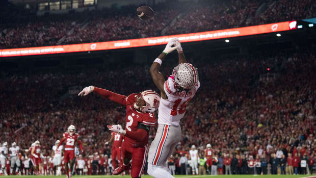 Wisconsin Badgers cornerback Ricardo Hallman (2) defends the pass intended for Ohio State Buckeyes wide receiver Marvin Harrison Jr. (18) during the first quarter at Camp Randall Stadium.